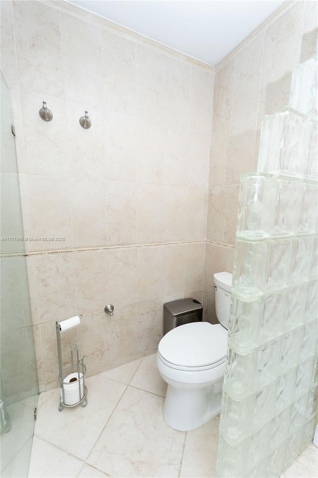 13080 NW 8th Ct, Sunrise, FL 33325 - bathroom with tile walls and toilet