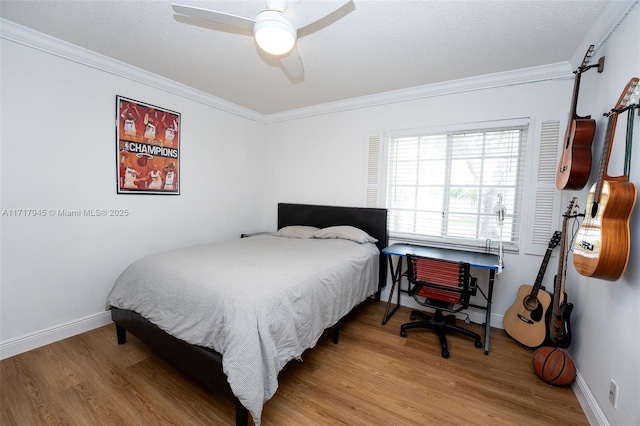 13080 NW 8th Ct, Sunrise, FL 33325 - bedroom with crown molding, wood finished floors, and a ceiling fan