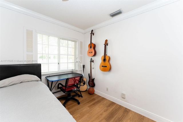 13080 NW 8th Ct, Sunrise, FL 33325 - bedroom with crown molding and light wood-type flooring