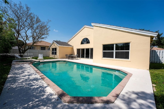 13080 NW 8th Ct, Sunrise, FL 33325 - view of swimming pool featuring a patio area and a pool with connected hot tub