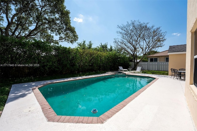 13080 NW 8th Ct, Sunrise, FL 33325 - view of swimming pool with a fenced backyard and a patio
