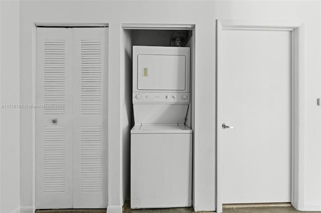 laundry room featuring stacked washer and dryer