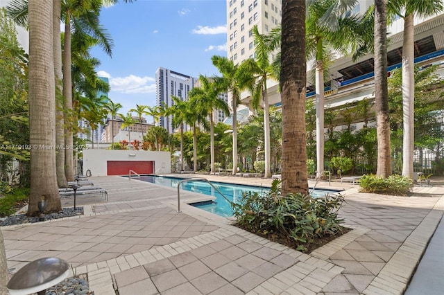 view of swimming pool with a patio