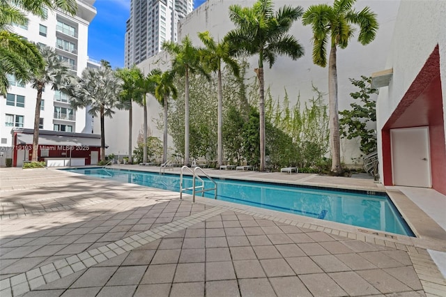 view of swimming pool featuring a patio