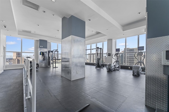 gym with a tray ceiling