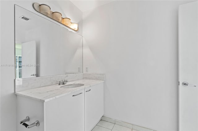 bathroom with vanity and tile patterned floors