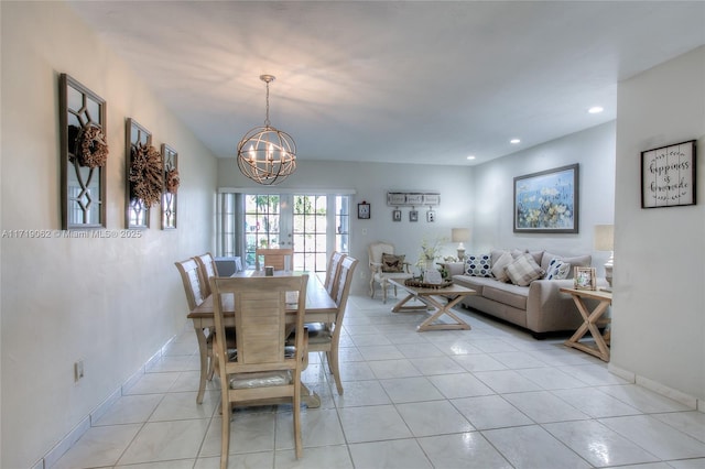 tiled dining space with a notable chandelier