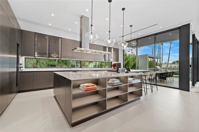 315 N Shore Dr, Miami Beach, FL 33141 - kitchen with open shelves, gray cabinetry, modern cabinets, island range hood, and pendant lighting