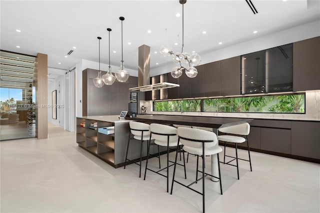315 N Shore Dr, Miami Beach, FL 33141 - kitchen with pendant lighting, recessed lighting, a kitchen breakfast bar, and modern cabinets