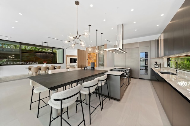 315 N Shore Dr, Miami Beach, FL 33141 - kitchen with pendant lighting, island exhaust hood, a sink, and modern cabinets