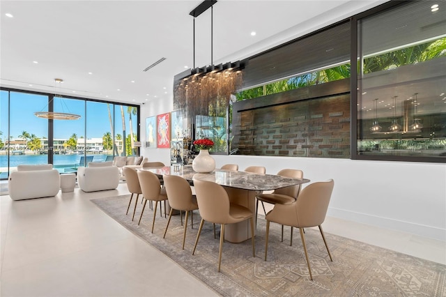 315 N Shore Dr, Miami Beach, FL 33141 - dining area with visible vents and floor to ceiling windows
