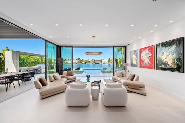 315 N Shore Dr, Miami Beach, FL 33141 - interior space with a water view, expansive windows, and recessed lighting
