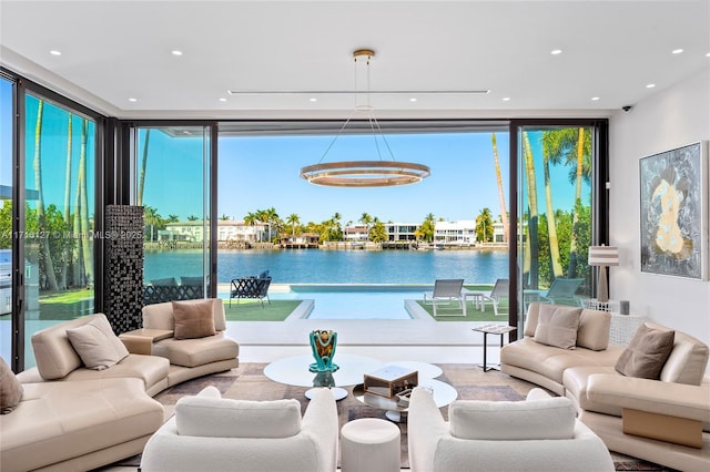 315 N Shore Dr, Miami Beach, FL 33141 - living room featuring recessed lighting, floor to ceiling windows, and a water view