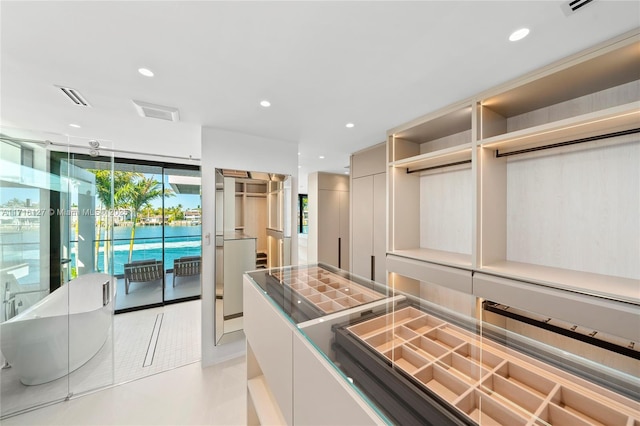 315 N Shore Dr, Miami Beach, FL 33141 - spacious closet featuring visible vents and light tile patterned flooring