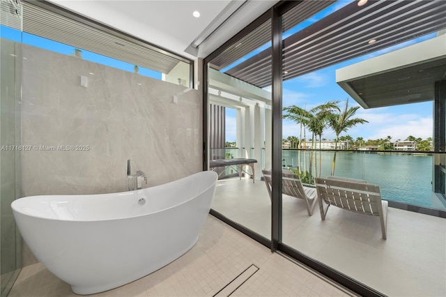 315 N Shore Dr, Miami Beach, FL 33141 - bathroom with a soaking tub and a water view