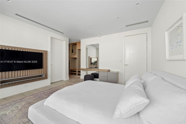 315 N Shore Dr, Miami Beach, FL 33141 - bedroom with visible vents and wood finished floors