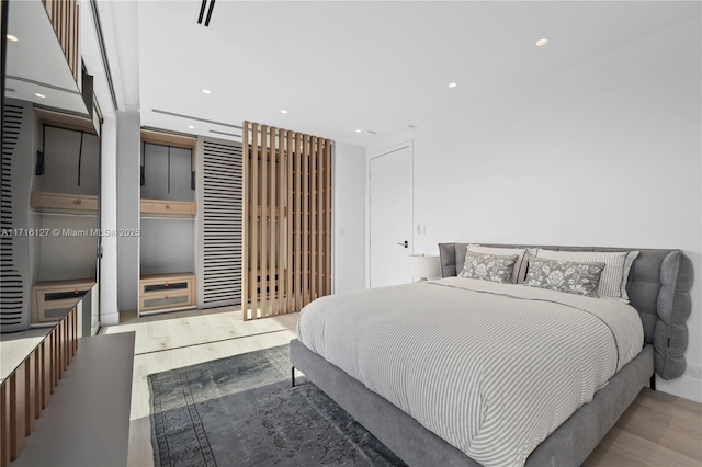 315 N Shore Dr, Miami Beach, FL 33141 - bedroom with wood finished floors and recessed lighting
