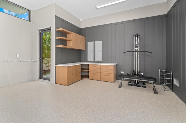 315 N Shore Dr, Miami Beach, FL 33141 - exercise room featuring built in desk and light colored carpet