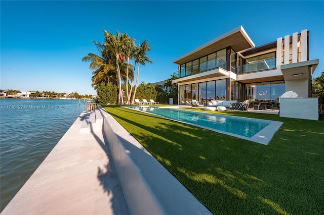 315 N Shore Dr, Miami Beach, FL 33141 - exterior space with a water view, a patio, a balcony, an infinity pool, and a yard