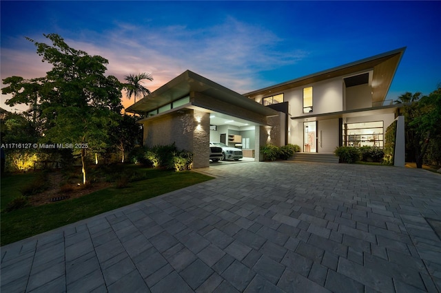 315 N Shore Dr, Miami Beach, FL 33141 - modern home with driveway and stucco siding