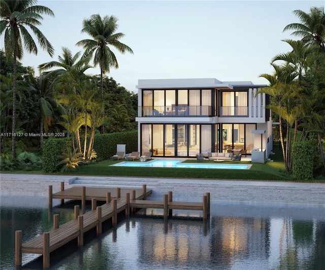 315 N Shore Dr, Miami Beach, FL 33141 - back of property with a balcony, an outdoor living space, an outdoor pool, a patio area, and a water view