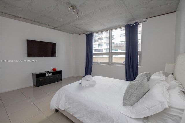 bedroom featuring light tile patterned floors