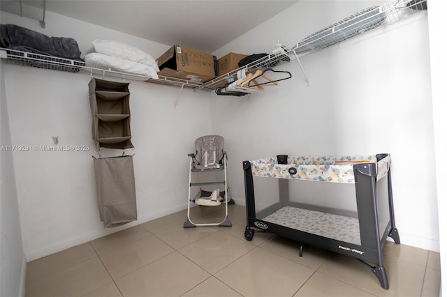 spacious closet with tile patterned floors