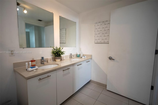 bathroom featuring tile patterned floors and vanity