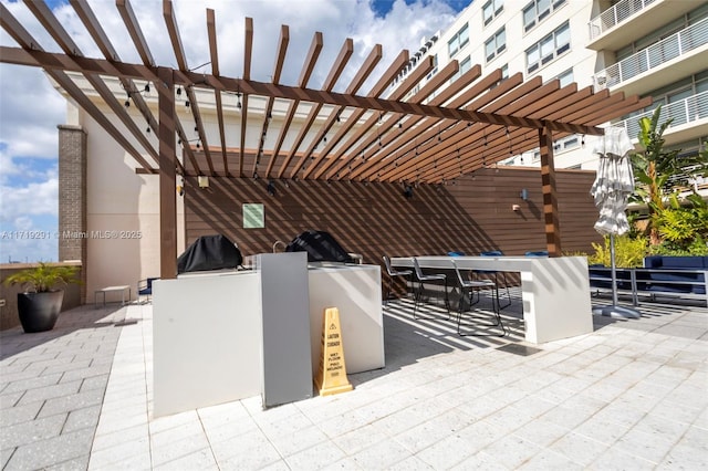 view of patio / terrace featuring an outdoor bar