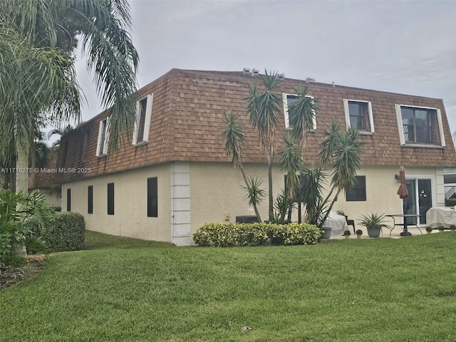 view of home's exterior with a yard