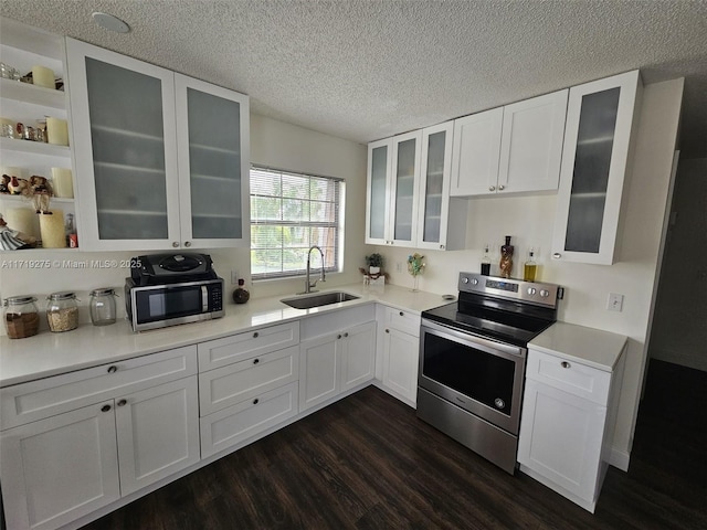 kitchen featuring white cabinets, dark hardwood / wood-style floors, sink, and appliances with stainless steel finishes