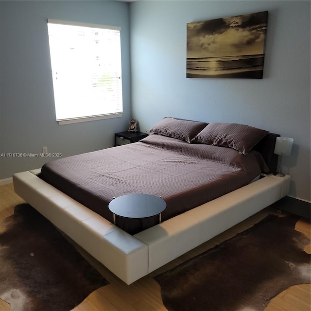 bedroom with wood-type flooring