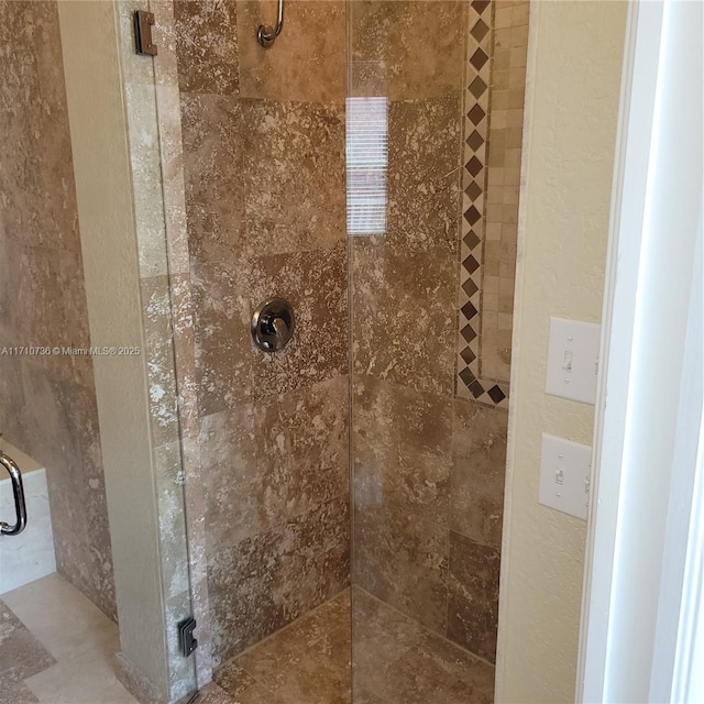 bathroom with a shower with shower door