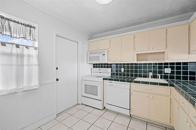 kitchen featuring light tile patterned flooring, tile countertops, sink, decorative backsplash, and white appliances