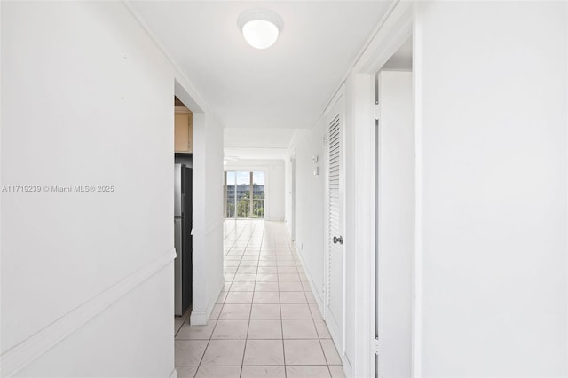 corridor featuring light tile patterned floors