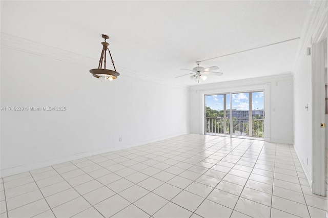 tiled empty room featuring ceiling fan and ornamental molding