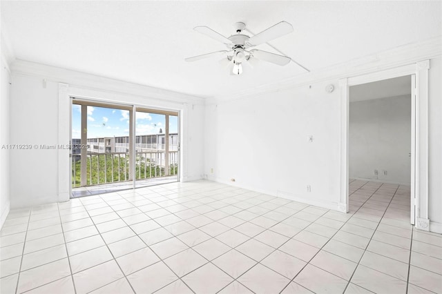 tiled spare room with ceiling fan and ornamental molding