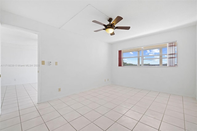 unfurnished room featuring light tile patterned floors and ceiling fan