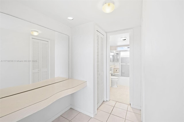 hallway with light tile patterned flooring