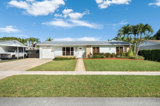 ranch-style home with a front lawn and a garage