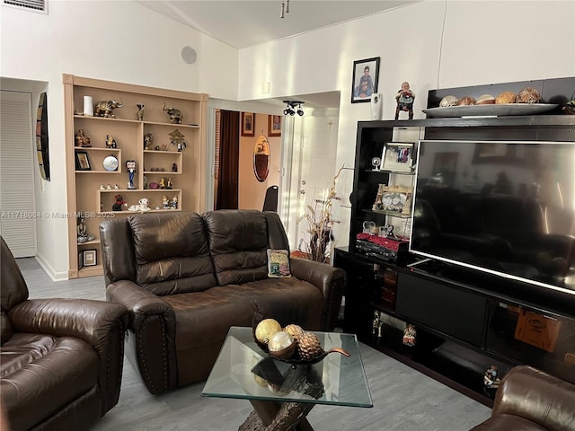 living room with light hardwood / wood-style flooring