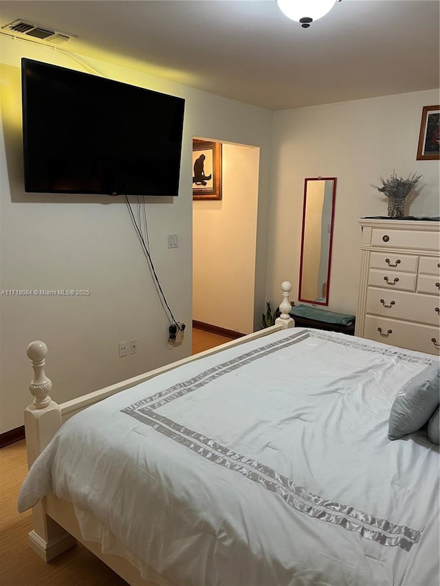 bedroom with light hardwood / wood-style floors