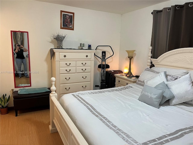 bedroom featuring light hardwood / wood-style floors