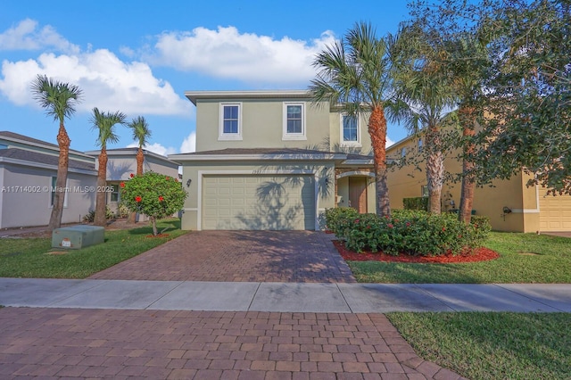 front of property with a front lawn and a garage