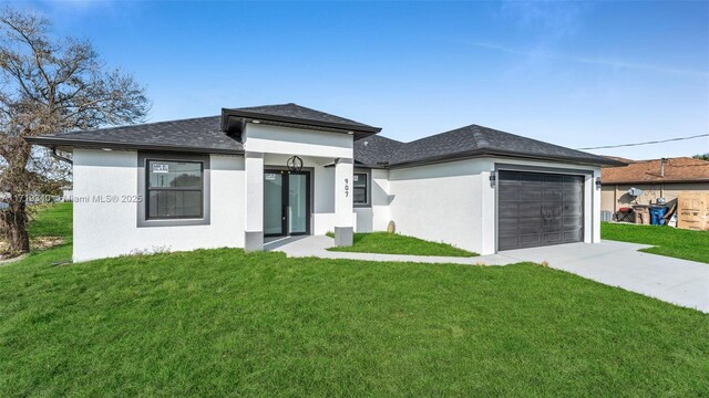 view of front of house featuring a front yard and a garage