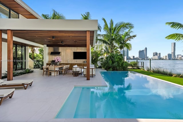 view of swimming pool featuring a patio and an outdoor hangout area