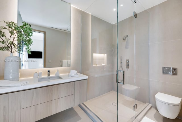 bathroom featuring vanity, an enclosed shower, tile walls, and toilet