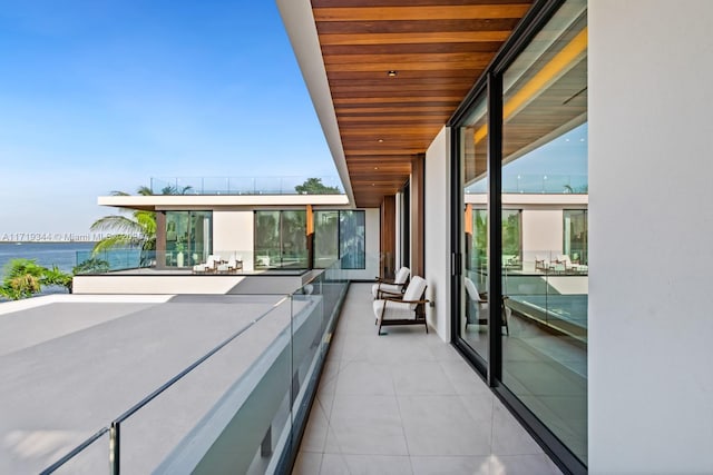 balcony featuring a water view