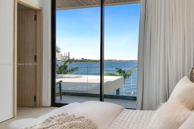 bedroom featuring a water view