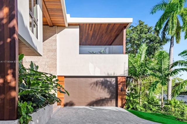 view of front of house with a balcony and a garage